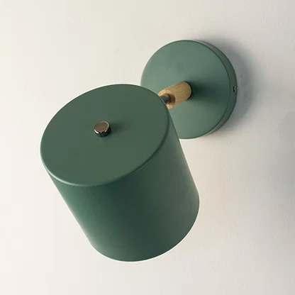 Contemporary green metal spotlight wall light with matte finish for elegant modern interior decor.