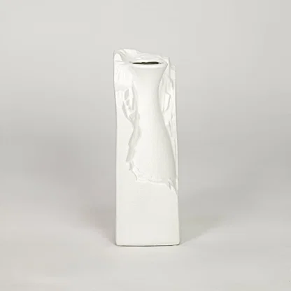 White ceramic flower vase with textured finish modern decorative vase for tabletop shelf console decor styling.