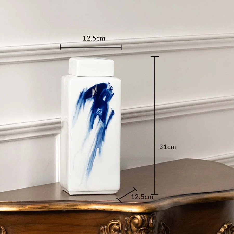 White ceramic jar with blue brushstroke artwork shown with dimensions 12.5 cm width and 21 cm height.