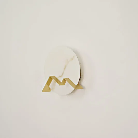 Apex Alabaster Wall Sconce switched off on white background.