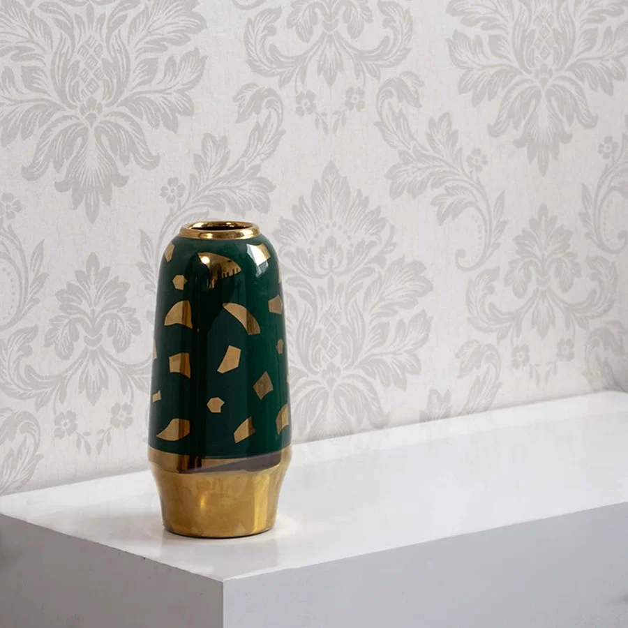 Modern green ceramic vase with gold base displayed on clean white background suitable for living room home decor.