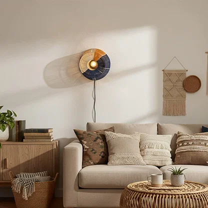 Wall mounted accent light placed above sofa creating soft illumination and a welcoming modern living room atmosphere.