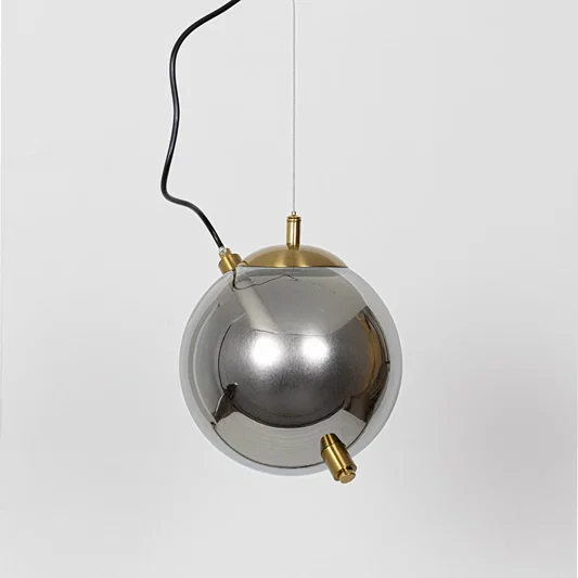 Smoke glass and gold metal pendant light designed for elegant dining room and modern home decor spaces.