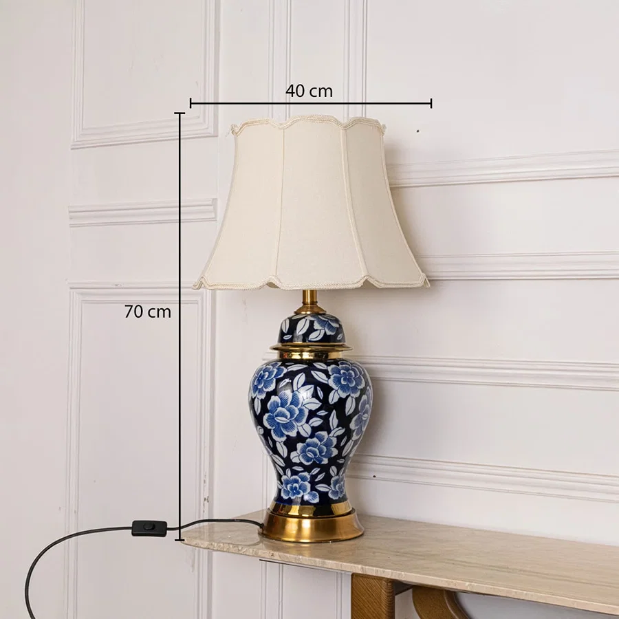 Blue floral ceramic table lamp 70 cm tall and 40 cm wide designed with a gold base and cream shade for elegant interior lighting.