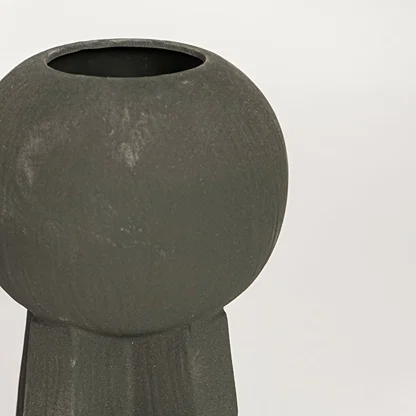 Black ceramic decorative vase with textured surface and sculptural form perfect for elegant dried floral display and interior decor.