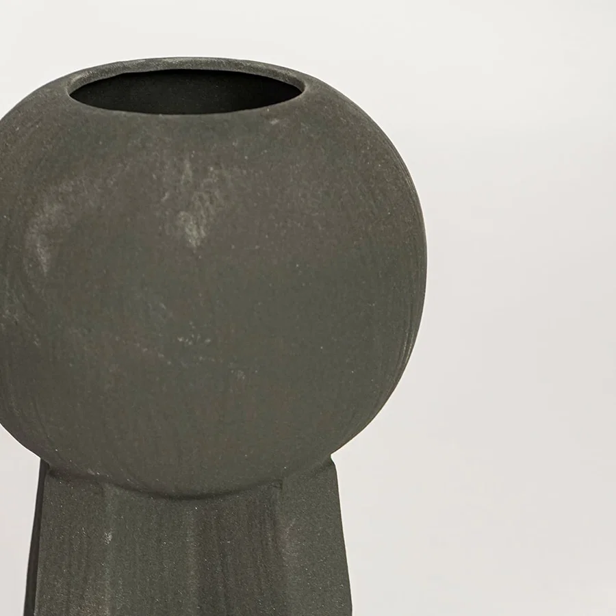 Black ceramic decorative vase with textured surface and sculptural form perfect for elegant dried floral display and interior decor.
