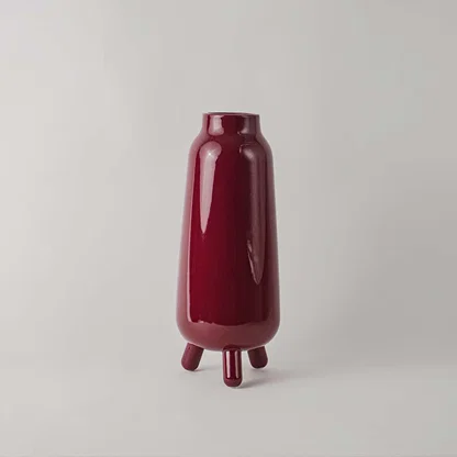 Baldarian wine color deco vase on white background showcasing smooth surface rich tone and statement styling for modern interiors.