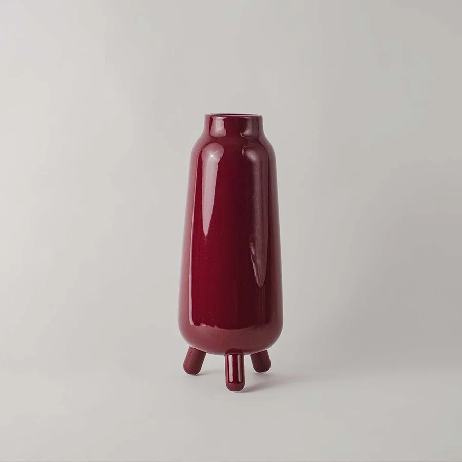 Baldarian wine color deco vase on white background showcasing smooth surface rich tone and statement styling for modern interiors.