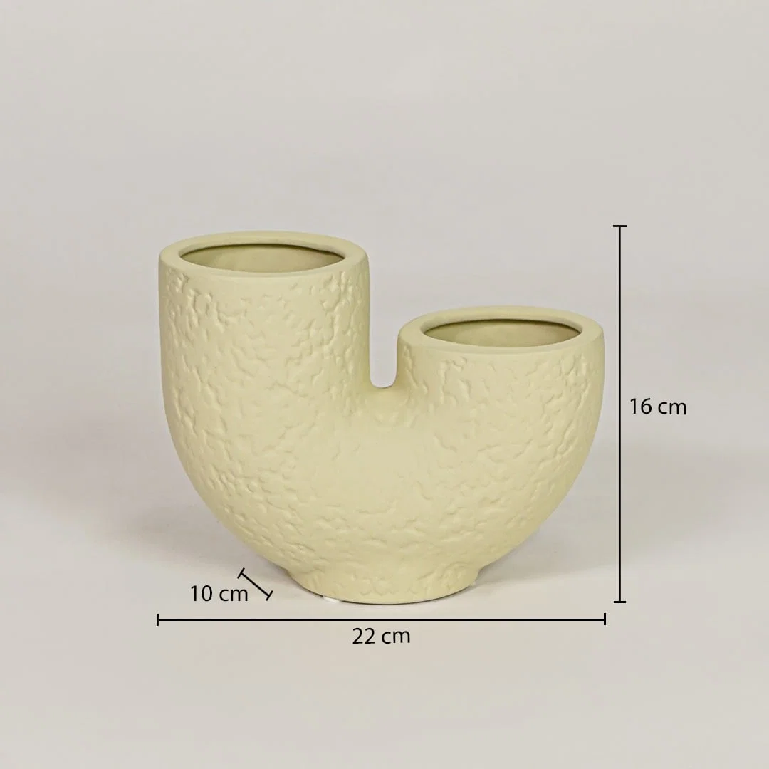Beige ceramic dual flower vase measuring 16 cm height and 22 cm width for modern decor styling placement.