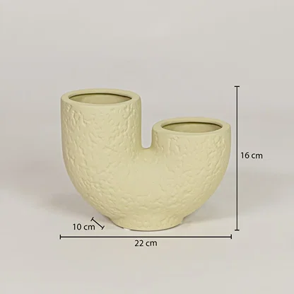 Beige ceramic dual flower vase measuring 16 cm height and 22 cm width for modern decor styling placement.