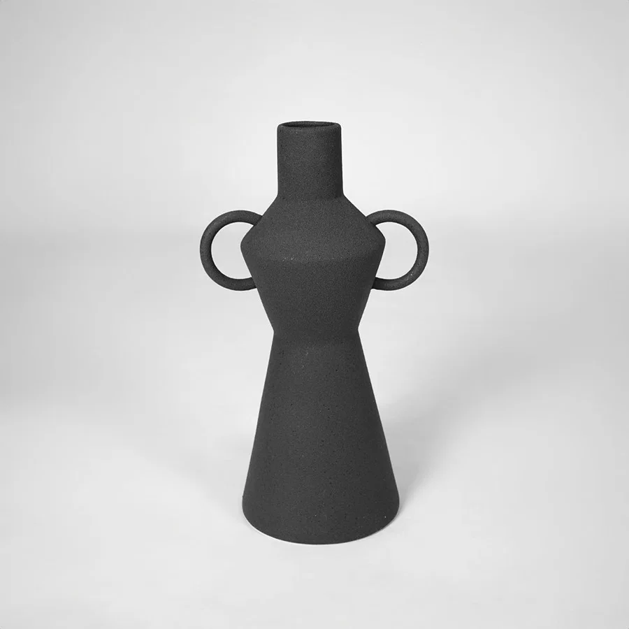 Black matte ceramic vase for stylish console table placement and contemporary indoor decor styling statement piece.