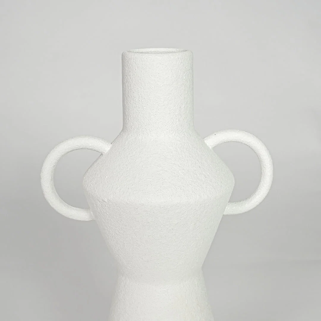 Closeup white ceramic textured decorative vase detail modern tall flower vase for table shelf console decor.