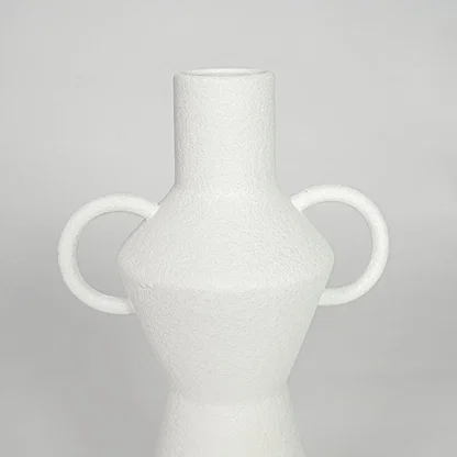 Closeup white ceramic textured decorative vase detail modern tall flower vase for table shelf console decor.