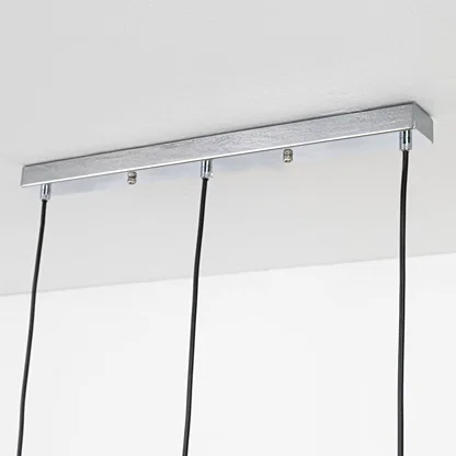 Silver metal linear ceiling canopy with hanging cords highlighting premium finish and craftsmanship.