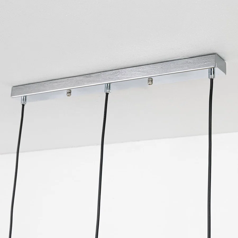 Silver metal linear ceiling canopy with hanging cords highlighting premium finish and craftsmanship.