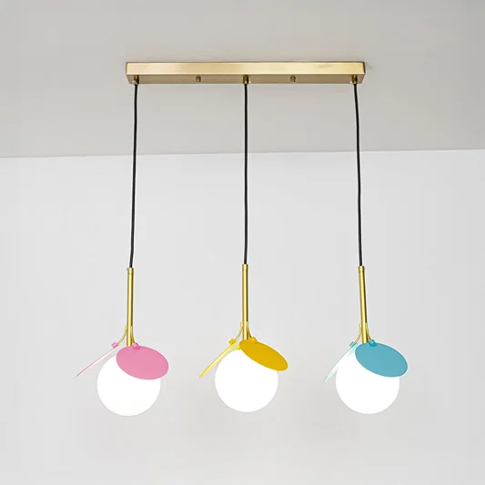 Pink yellow and blue metal pendant lights designed for cheerful contemporary home decor spaces.