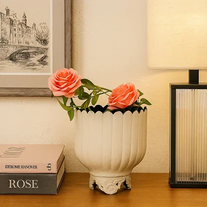 Cream metal scalloped planter decor styled in a warm modern room adding an elegant touch to living room tables and corners.