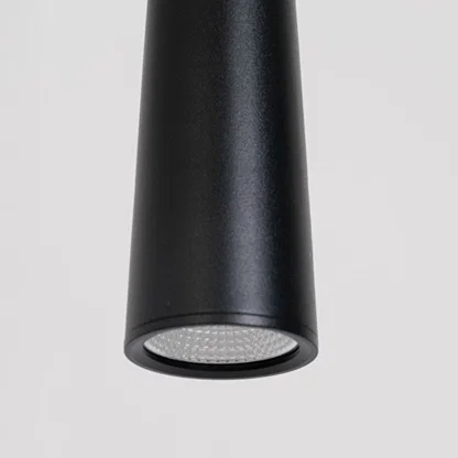 Closeup of black metal cone pendant light showcasing smooth finish and contemporary craftsmanship.