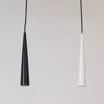 Pair of black and white metal cone pendant lights designed for elegant dining room interiors.
