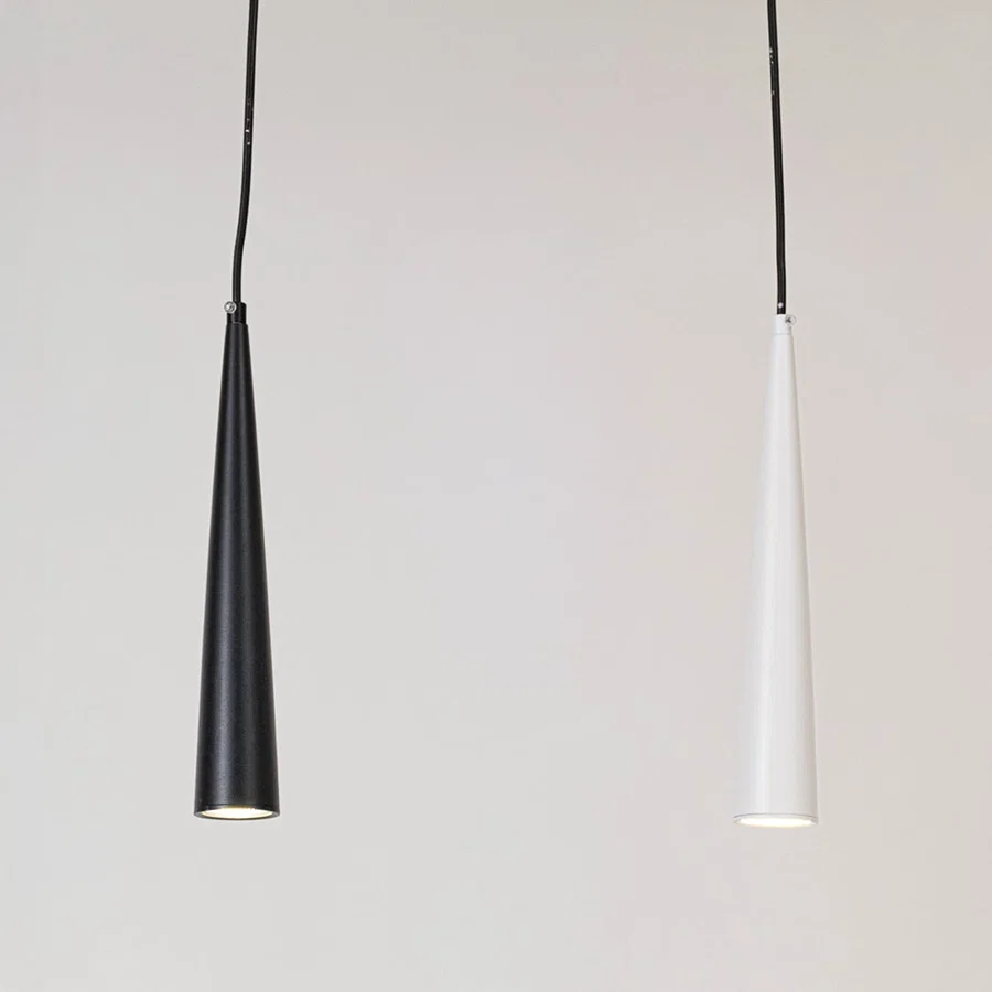 Black and white metal cone pendant lights showcasing sleek minimalist designs for modern home decor spaces.