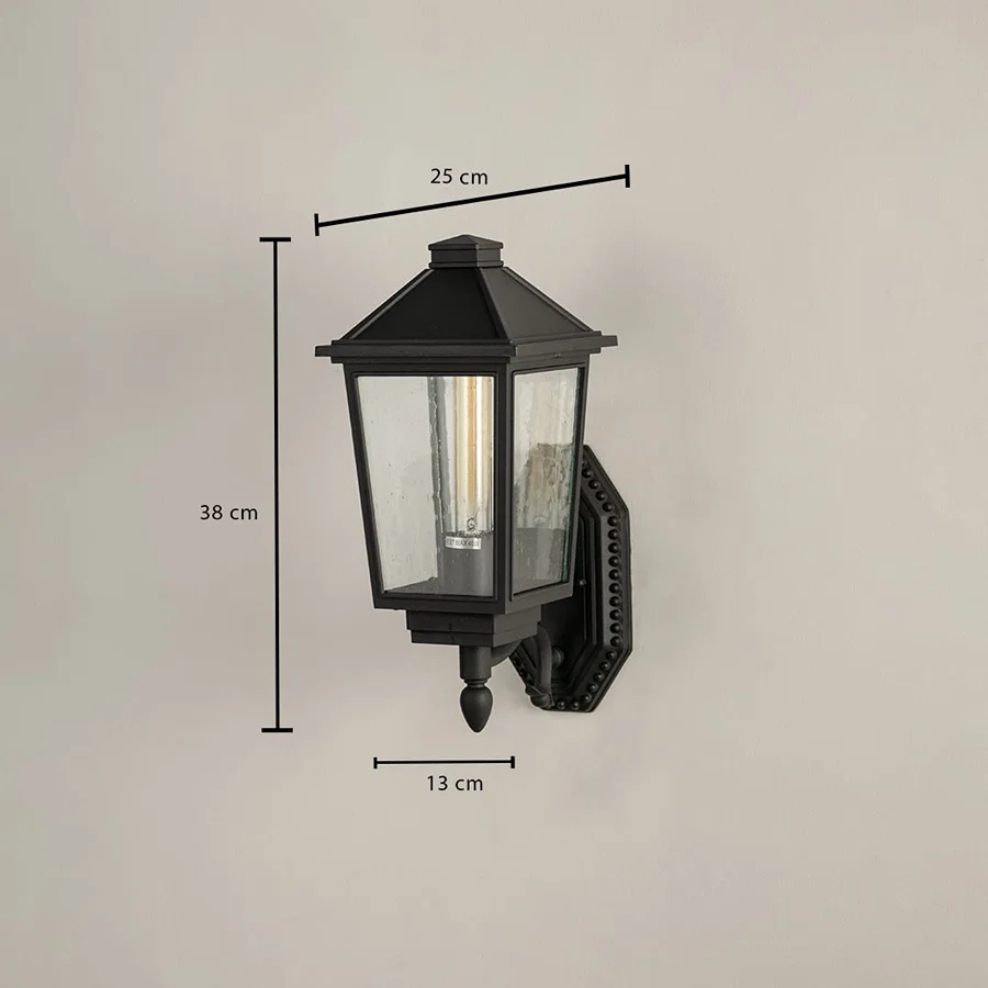Black metal outdoor lantern with textured clear glass shown with 38 cm height 25 cm width and 13 cm depth for accurate outdoor installation sizing.