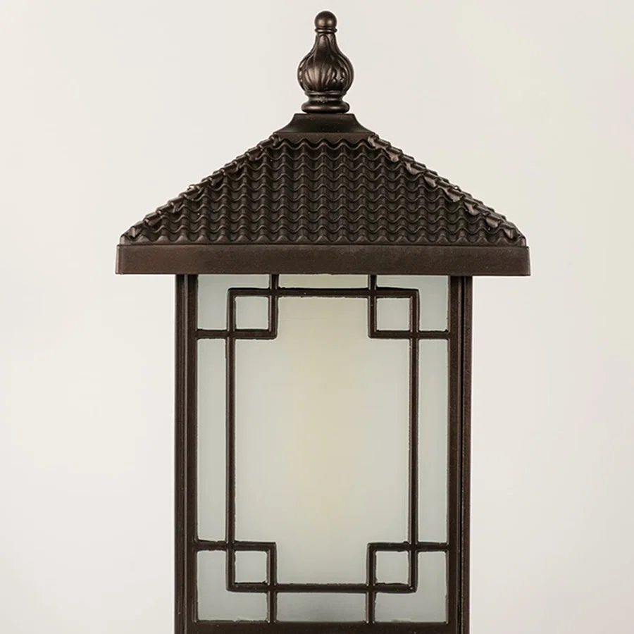 Black outdoor lantern Closeup seeded glass Light On showing the warm ambient glow and decorative pebbled glass panels detail.