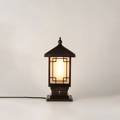 Vintage black outdoor gate light with warm ambient glow for luxury exterior decor styling use.