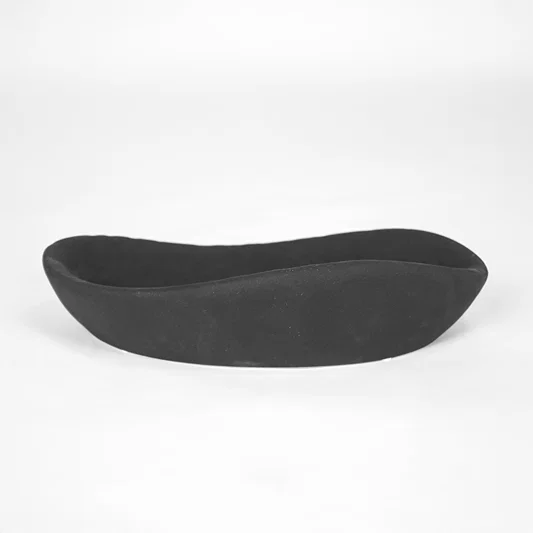 Black ceramic decorative tray for stylish coffee table placement and contemporary indoor decor styling accent piece.