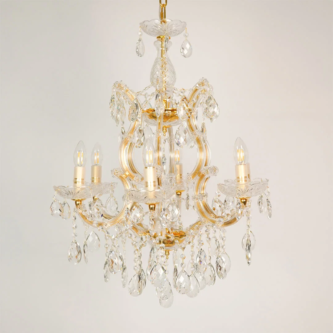 White background image of candelabra chandelier for elegant dining room decor styling with unlit arms.