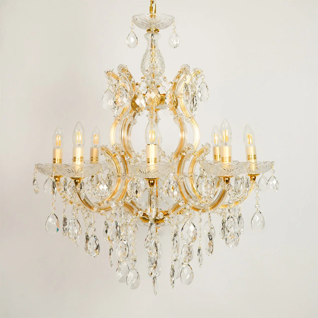 White background image of large candelabra chandelier for elegant dining room decor styling with unlit arms.