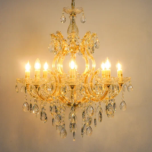 White background image of large candelabra chandelier for modern living room decor styling with a bright warm glow.