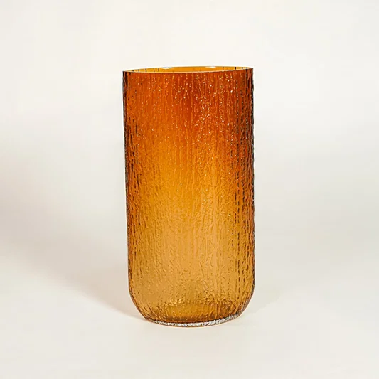 Amber decorative textured glass vase on white background modern home decor accent piece for table floor console styling interior.