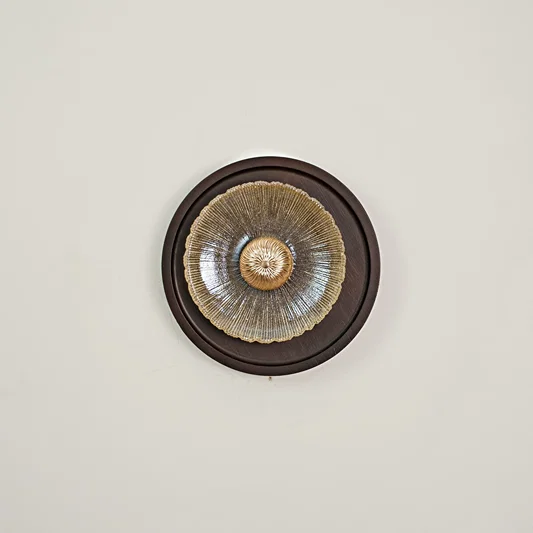 Celestial Fluted Art Wall Light switched off on white background.