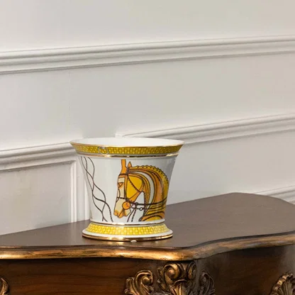 White ceramic jar with gold and yellow horse artwork in a front view ideal for upscale décor styling and decorative tabletop display.