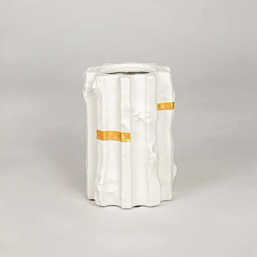 White ceramic decorative vase with gold accent modern flower vase for shelf console table living room home decor styling.