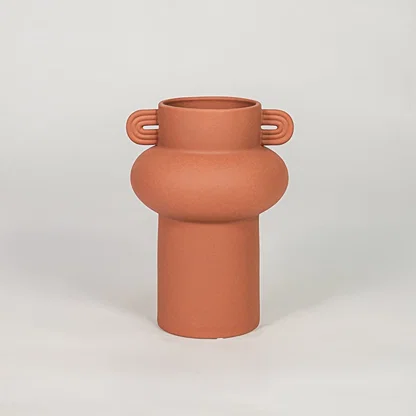 Orange ceramic decorative flower vase with matte finish modern vase for tabletop shelf console living room home decor styling.