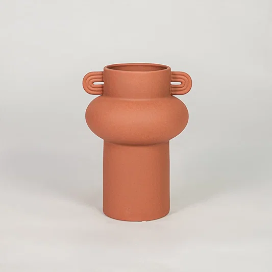 Orange ceramic decorative flower vase with matte finish modern vase for tabletop shelf console living room home decor styling.