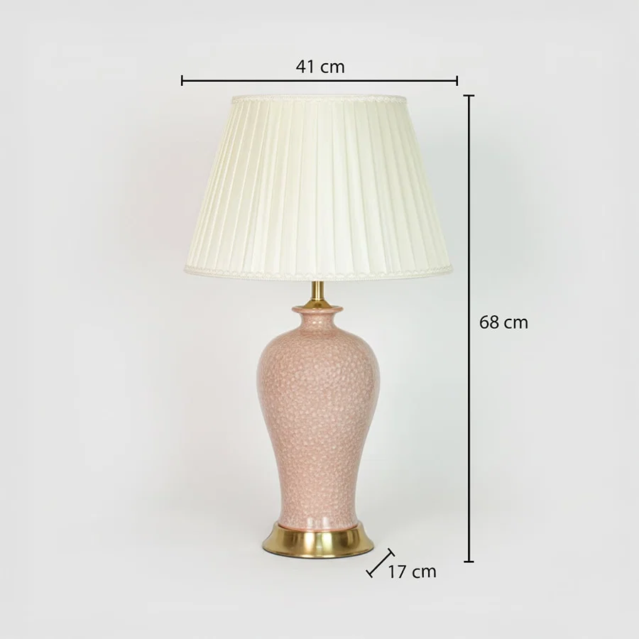 Pink ceramic table lamp showing 68 cm height 41 cm shade width and 17 cm base size ideal for bedroom placement.