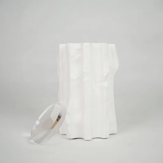 White textured ceramic candle jar for modern coffee table placement and elegant indoor decor styling accent piece.