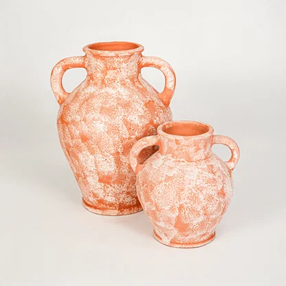 White background image of peach ceramic vase set for elegant interior decor styling with artistic matte finish.