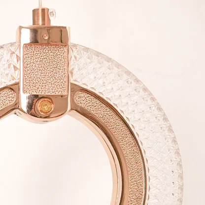 Detailed closeup of premium rose gold led ring wall sconce light fixture showing textured glass for luxury home decor.