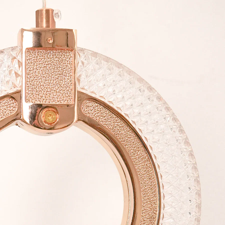 Detailed closeup of premium rose gold led ring wall sconce light fixture showing textured glass for luxury home decor.