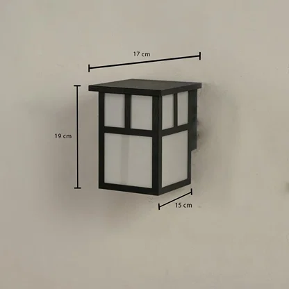 Outdoor wall light showing 19 cm height 17 cm width and 15 cm depth with a modern geometric structure.