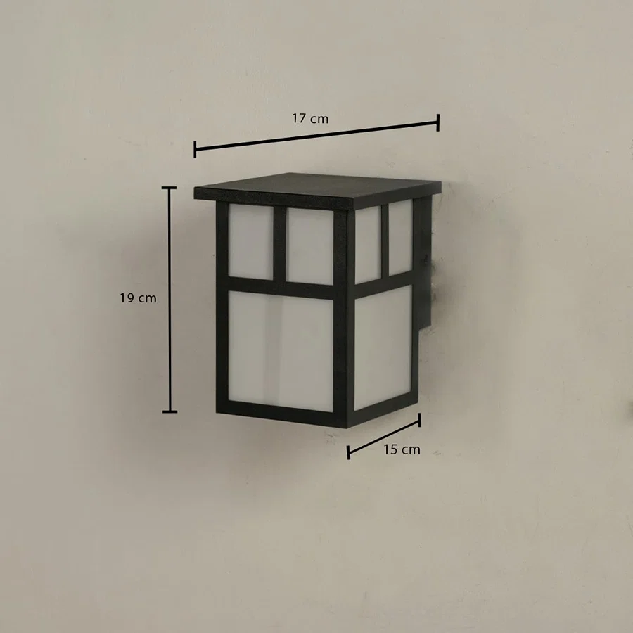 Outdoor wall light showing 19 cm height 17 cm width and 15 cm depth with a modern geometric structure.