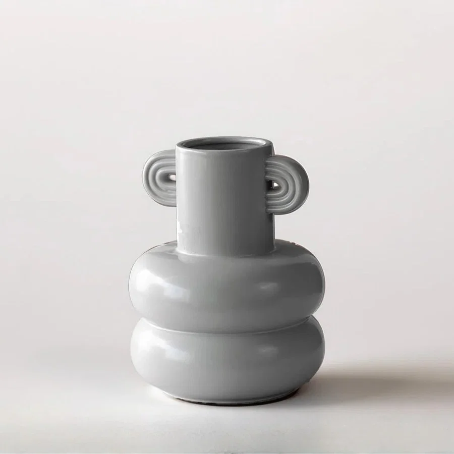 White ceramic sculptural vase with rounded stacked design for tabletop styling and modern home decor displays.