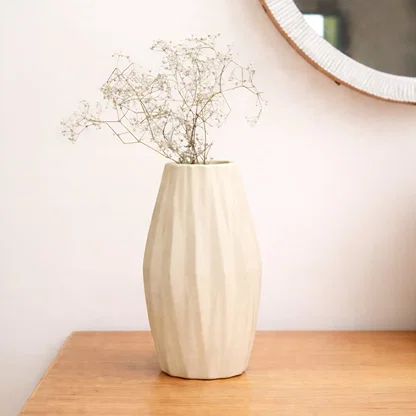 Beige ceramic textured decorative vase with vertical fluted design perfect for dried flower display on console table and modern home decor.