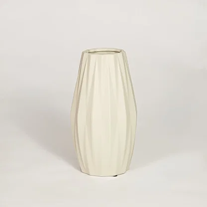 Modern beige ceramic fluted decorative vase ideal for dried flower arrangement on console table shelf and stylish home decor.