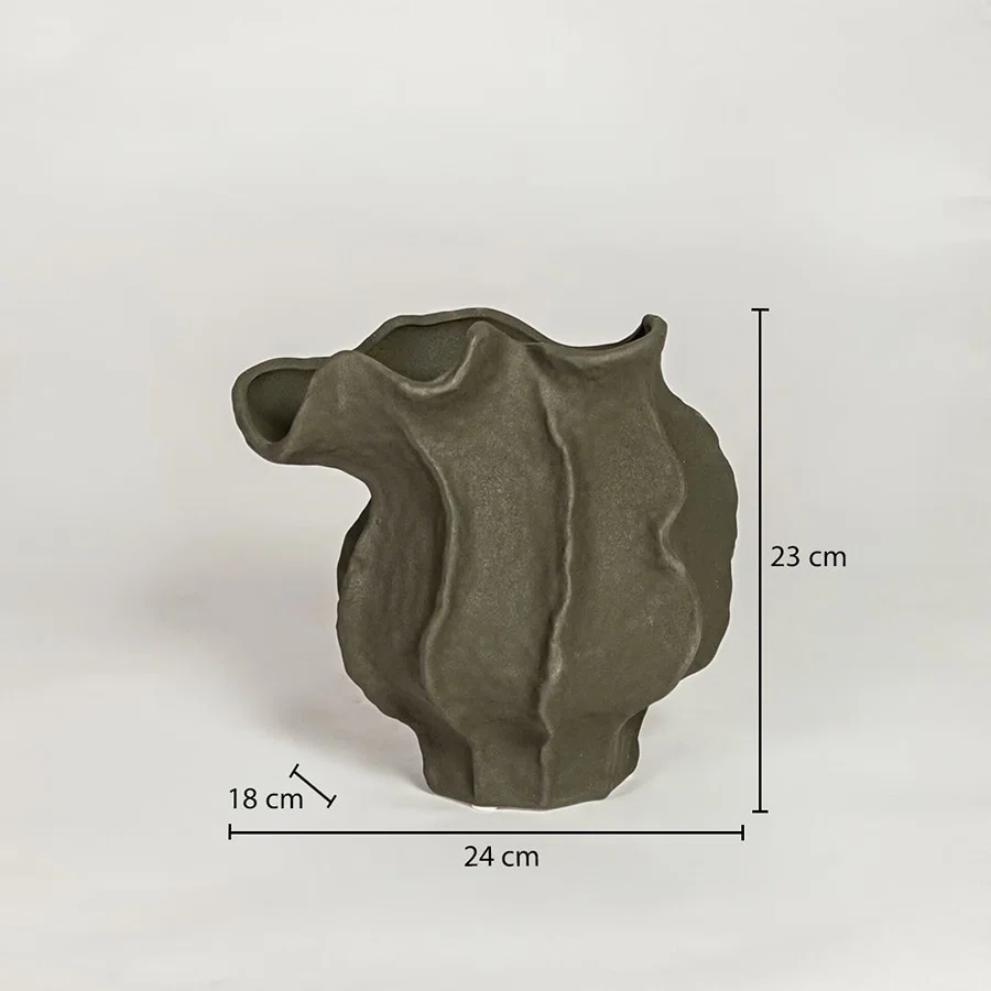 Dark green ceramic sculpted vase measuring 23 cm height 24 cm width and 18 cm depth ideal for modern decor placement.