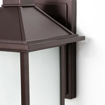 Closeup of Dorm outdoor wall light crafted in metal displaying sturdy structure refined finish and functional exterior wall lighting style.