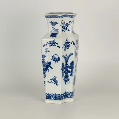 Blue and white ceramic decorative vase with traditional floral pattern for modern shelf styling and home decor displays.